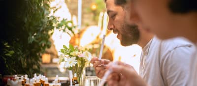Guests blending scents at an outdoor perfume-making workshop in Istanbul