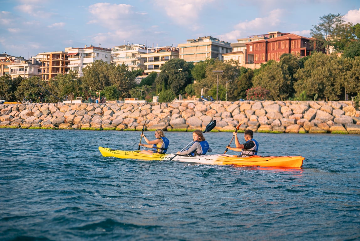 Late afternoon light on the Bosphorus as paddlers return to shore